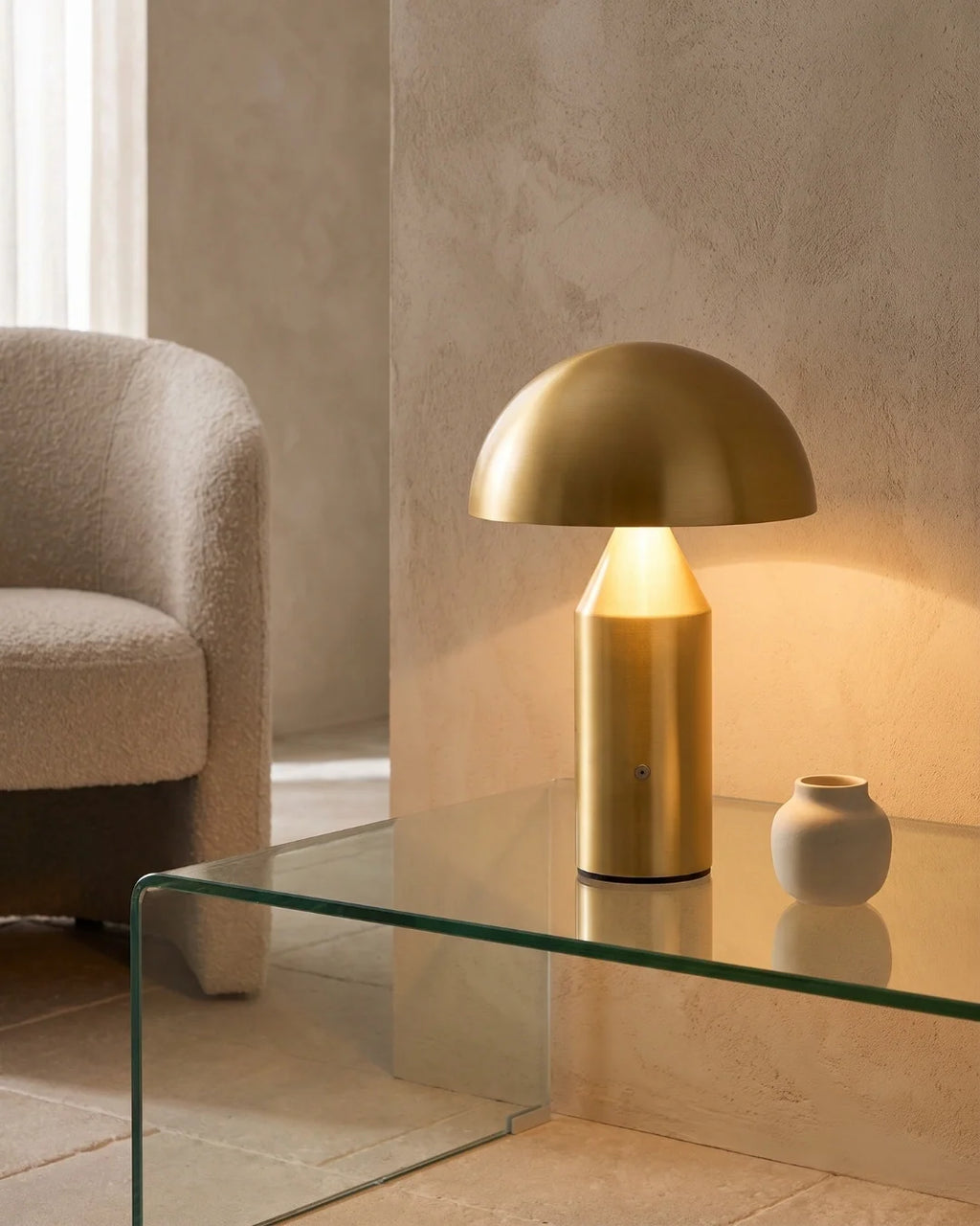 Gold mushroom lamp on glass table