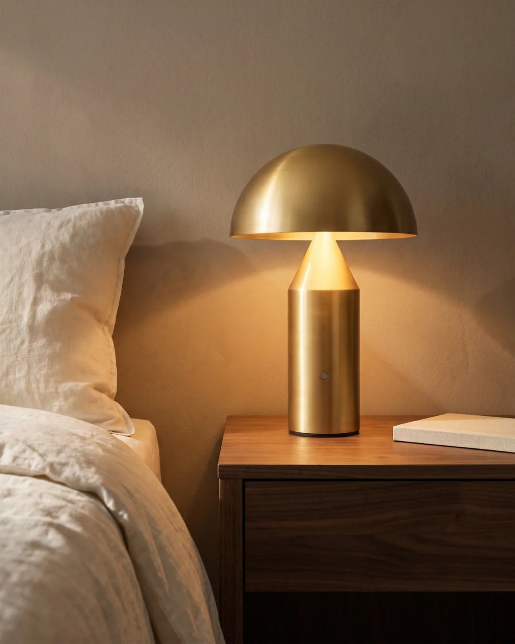 Gold mushroom lamp on nightstand