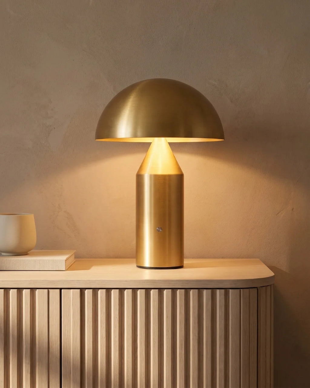 Gold mushroom lamp on sideboard