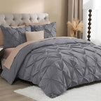Gray pinch pleat bedding with blush accents