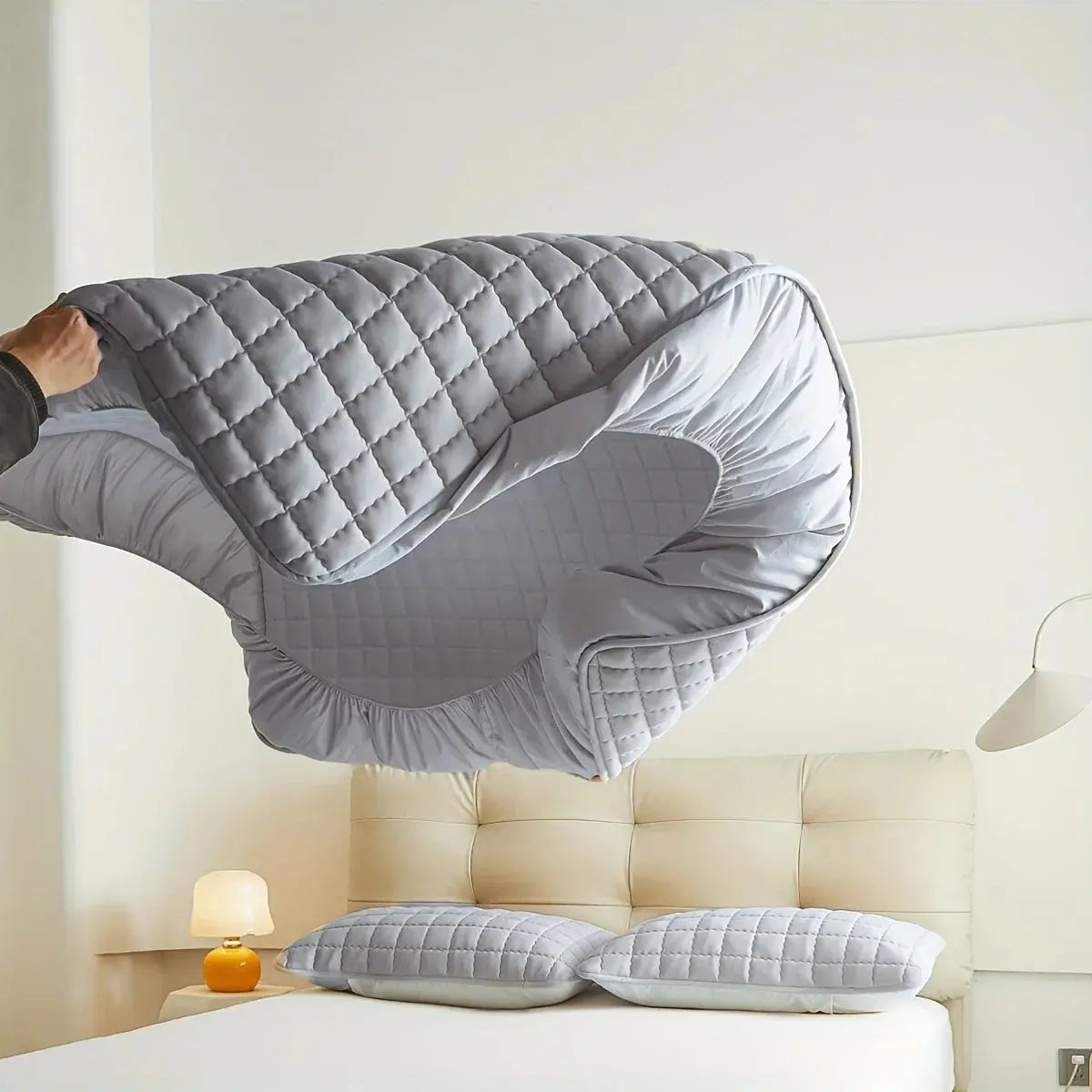 Gray quilted mattress protector
