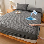 Gray quilted waterproof mattress pad with water spill