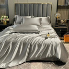 Gray satin bedding set on bed
