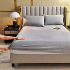 Gray velvet fitted sheet on bed