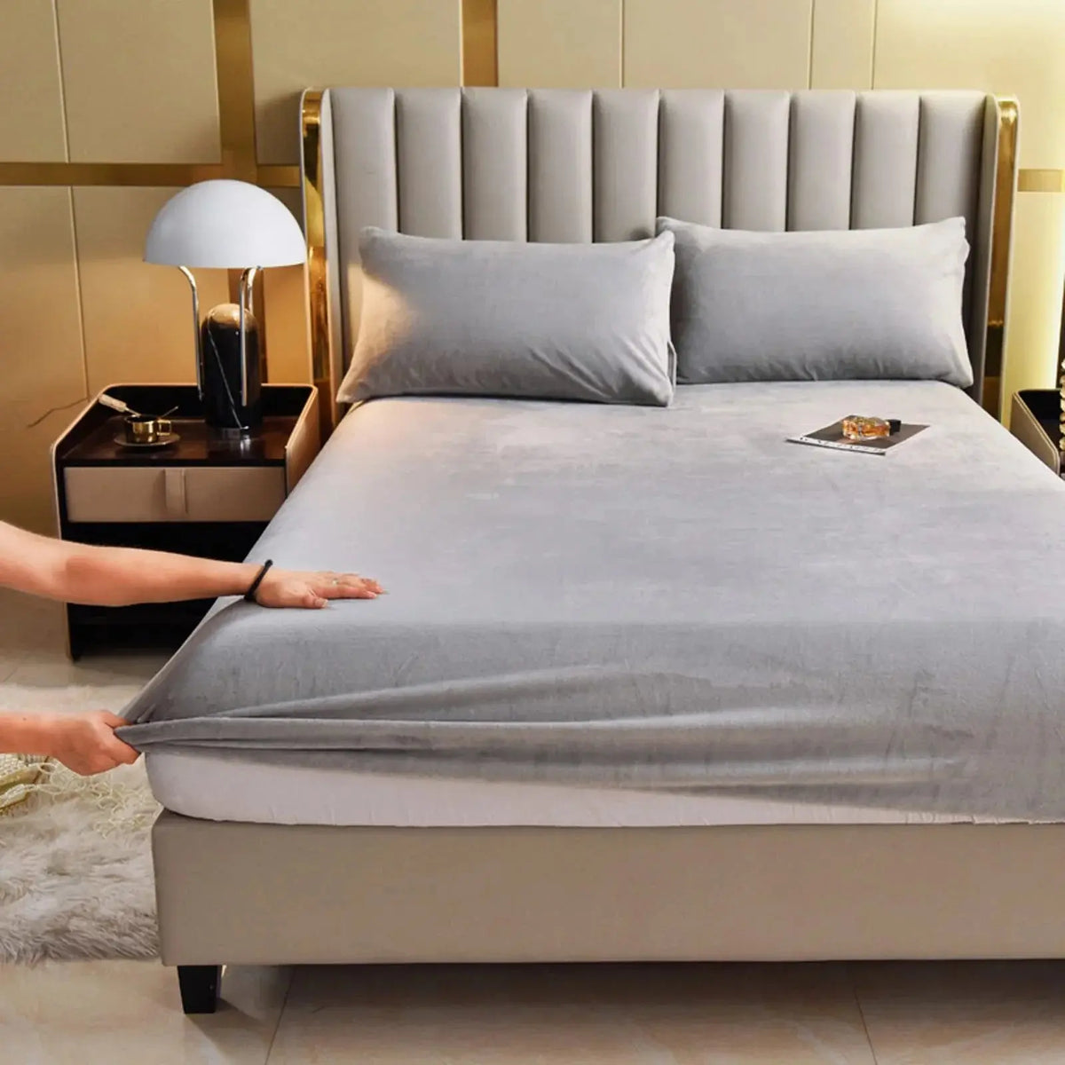 Gray velvet fitted sheet on bed