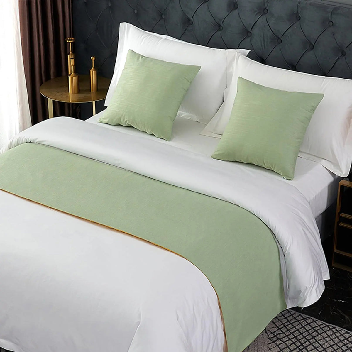 Green velvet bed runner on bed