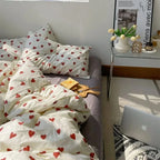 Heart print duvet cover on bed by desk