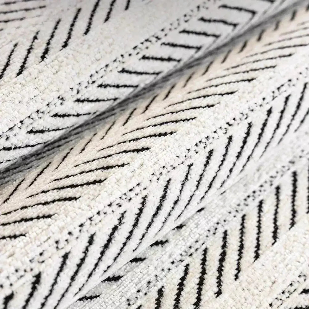 Close-up of black and white herringbone sofa protector fabric