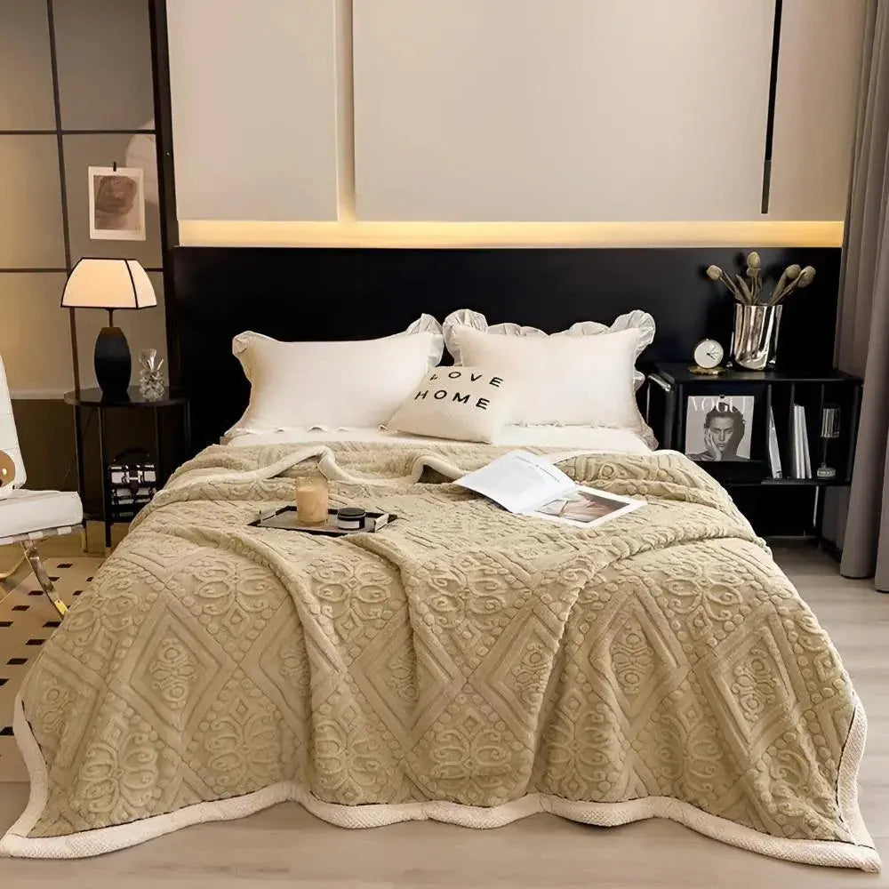 Khaki embossed fleece blanket on bed
