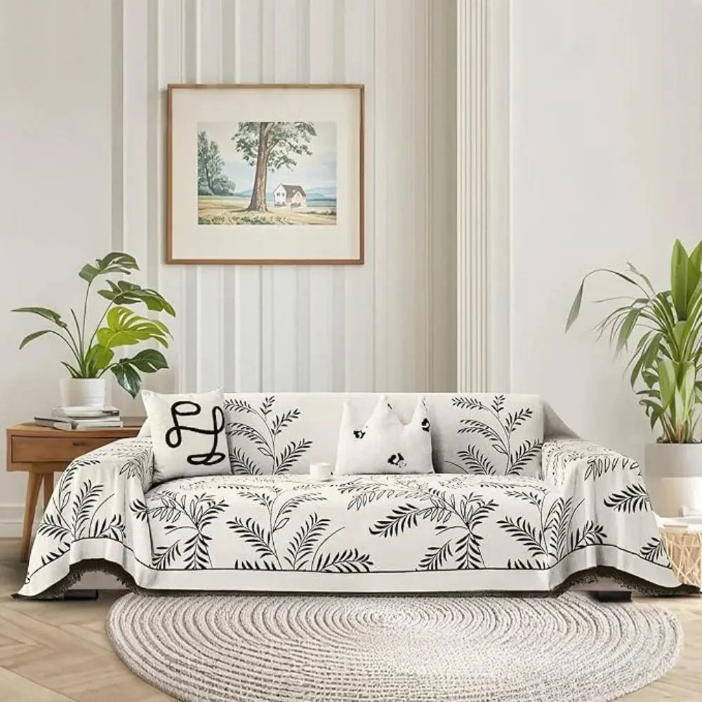 Leaf pattern couch cover on sofa in bright living room