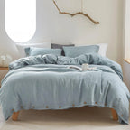 Light blue cotton duvet cover set on bed