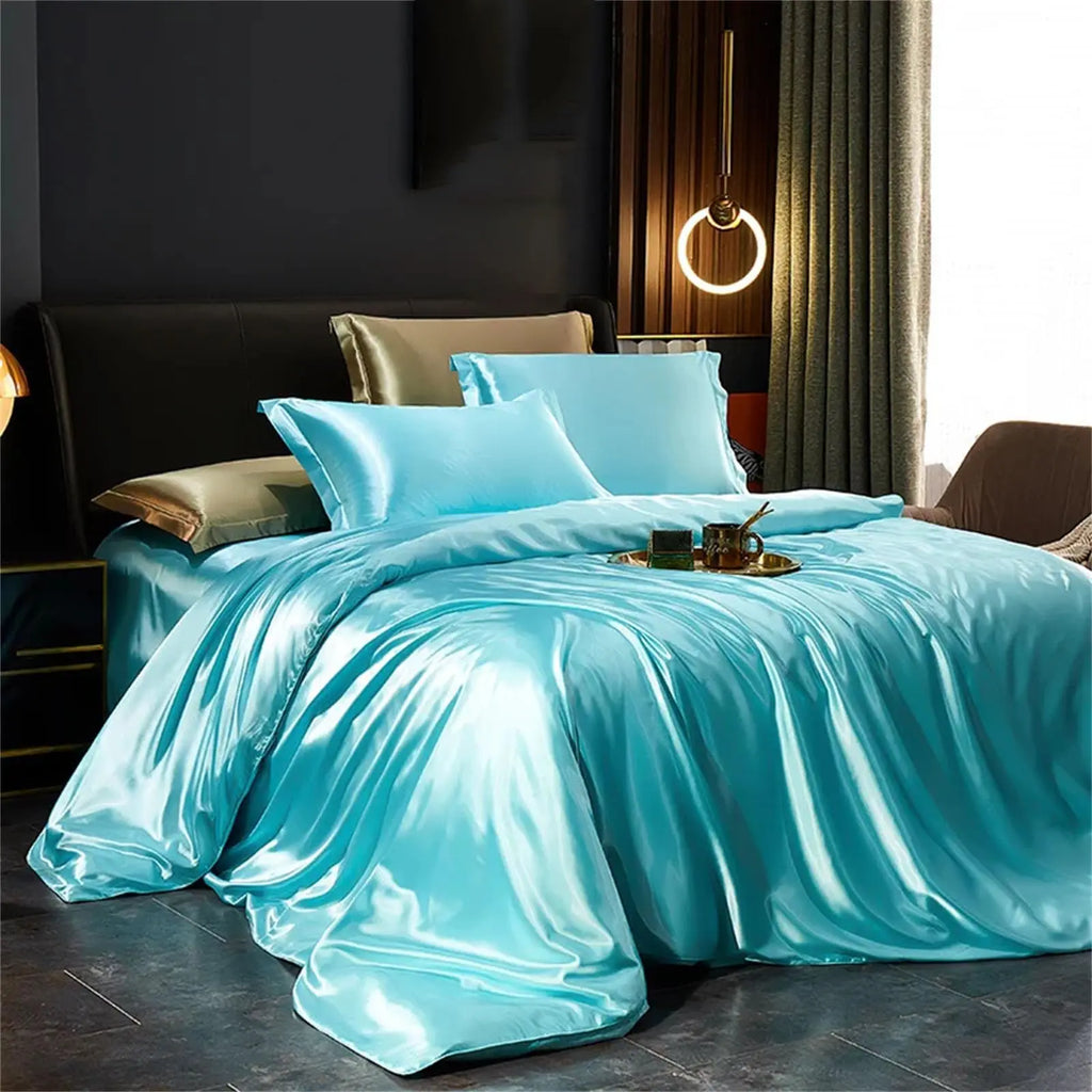 Light blue satin bedding set on bed