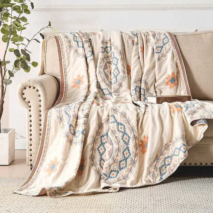 Lightweight boho bedspread draped over bed
