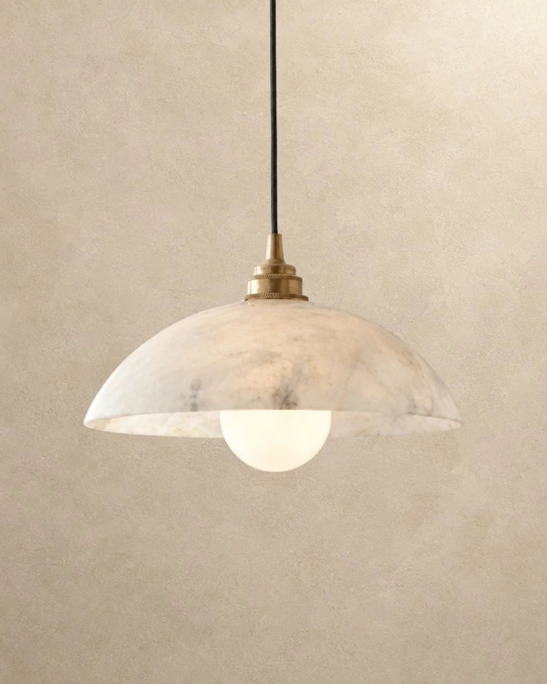 Marble dome pendant light with brass
