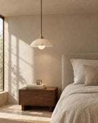 Marble pendant light by bed