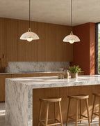Marble pendant lights over kitchen island
