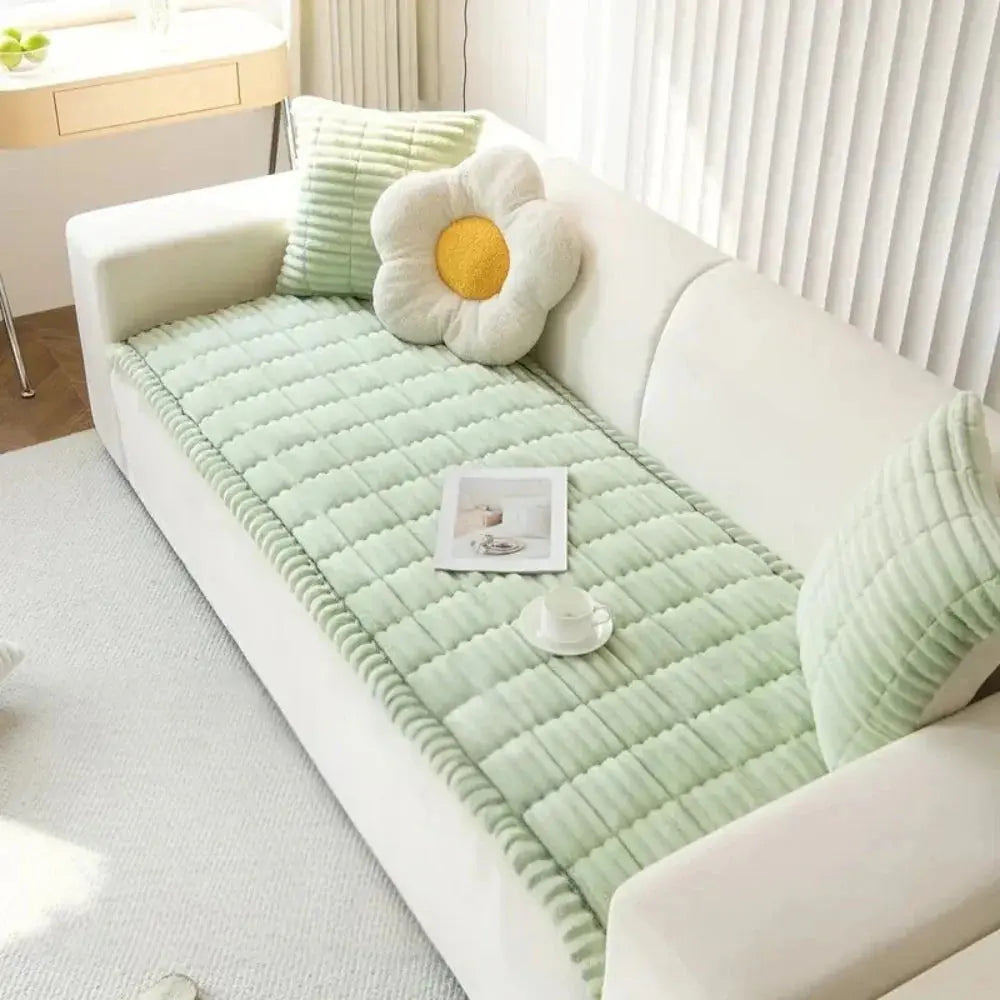 Mint green quilted couch cushion cover on sofa