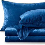 Navy blue fleece sheet set folded with pillowcases