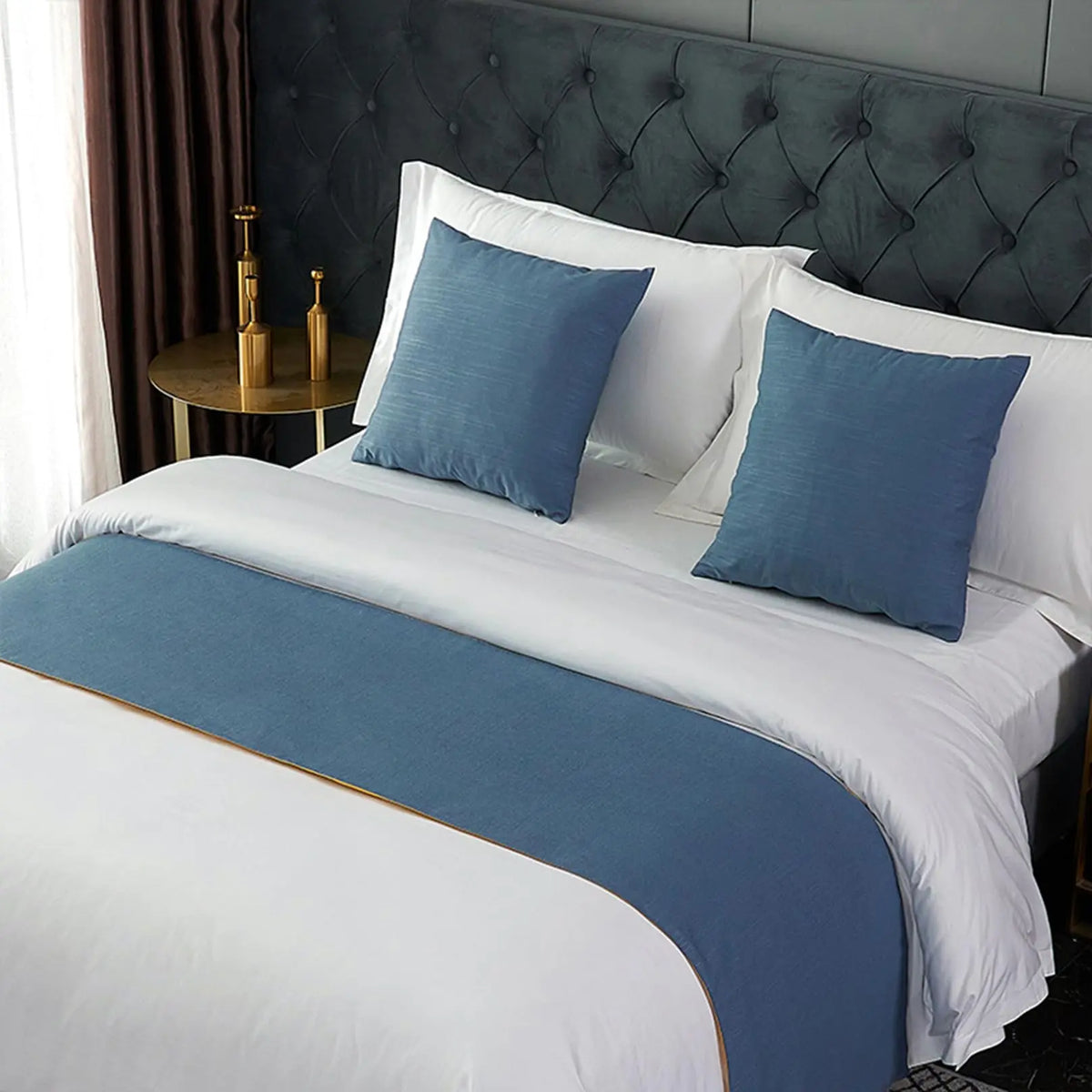 Navy blue velvet bed runner on bed