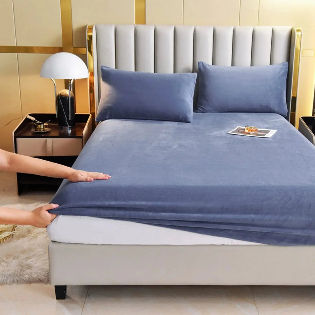 Navy blue velvet fitted sheet on bed