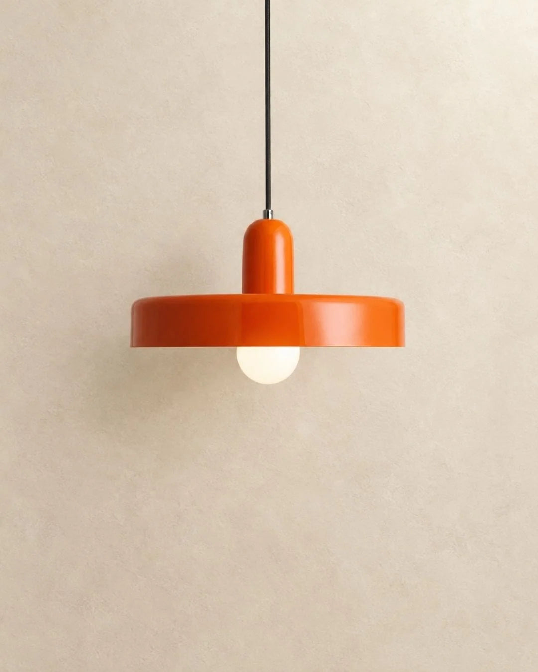 Orange disc pendant light
