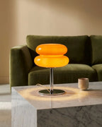 Orange glass lamp on coffee table