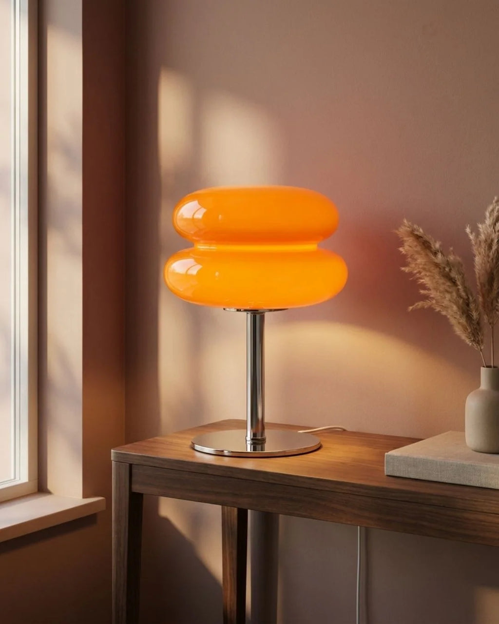 Orange glass lamp on console
