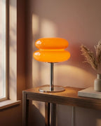 Orange glass lamp on console