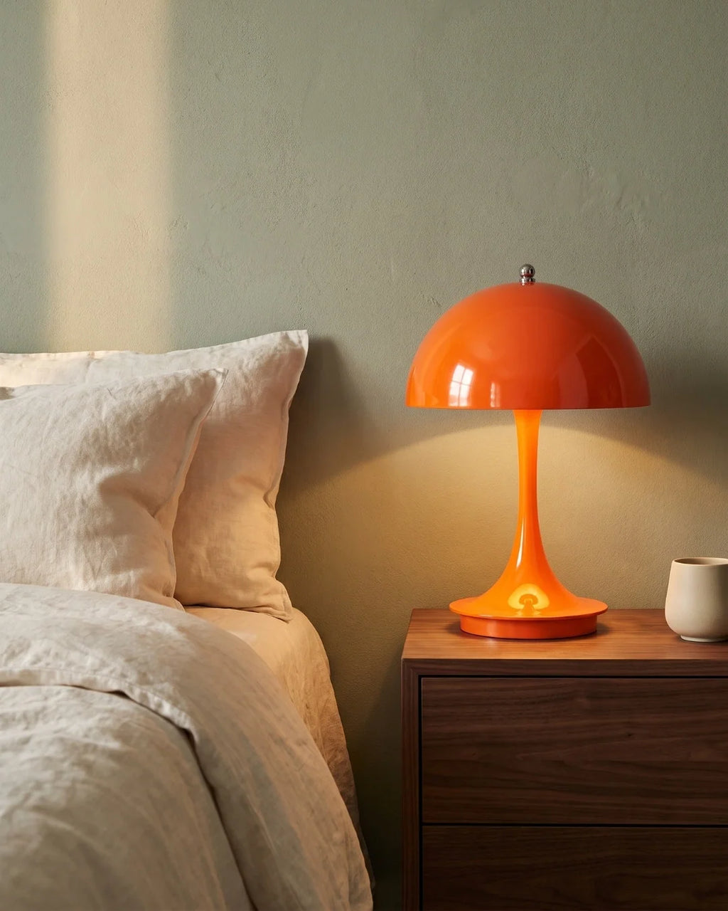 Orange mushroom lamp on nightstand