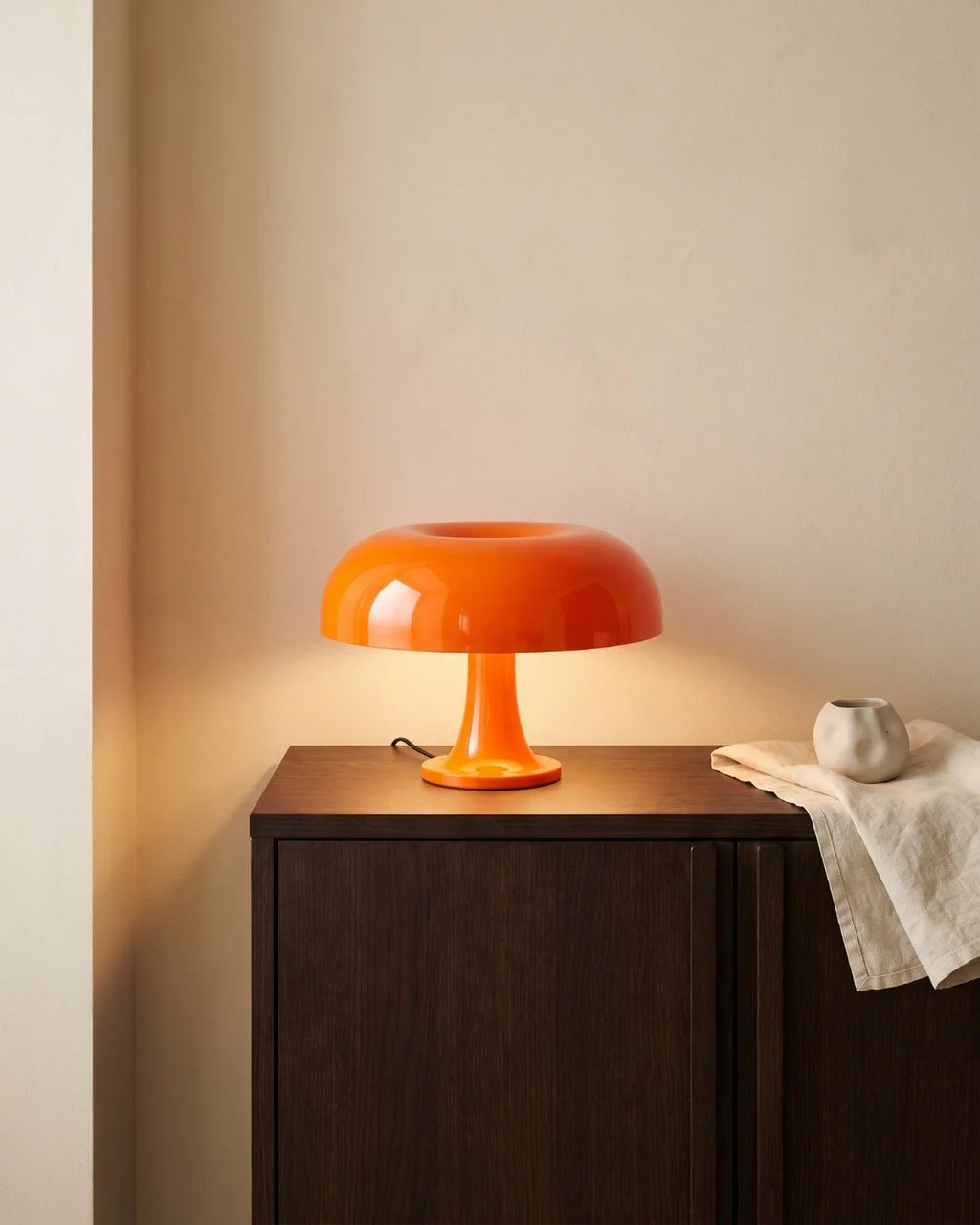 Orange mushroom lamp on nightstand