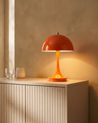 Orange mushroom lamp on sideboard