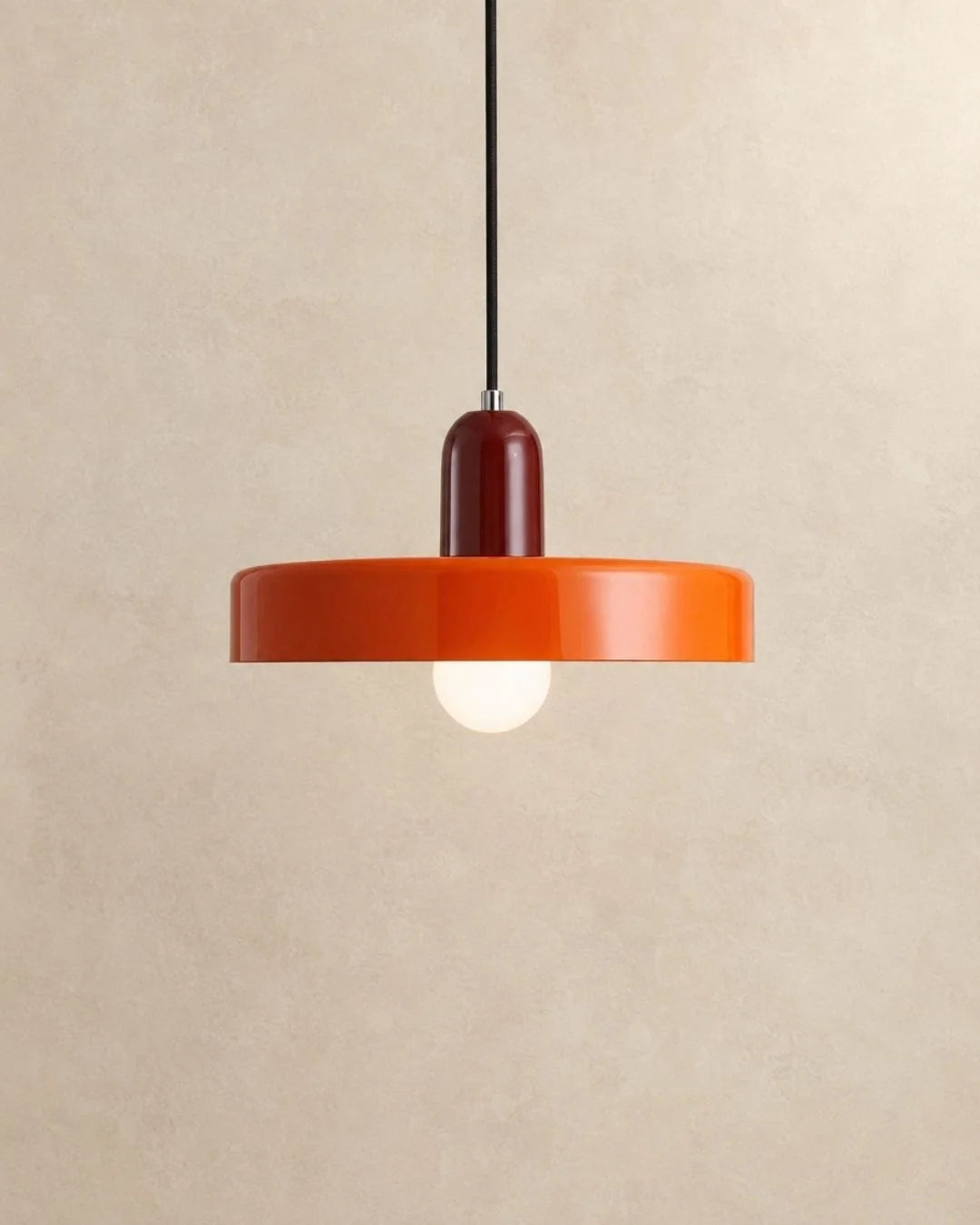 Orange pendant light with burgundy holder