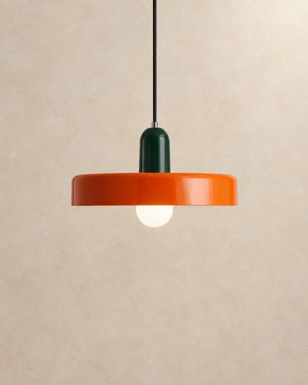 Orange pendant light with dark green holder