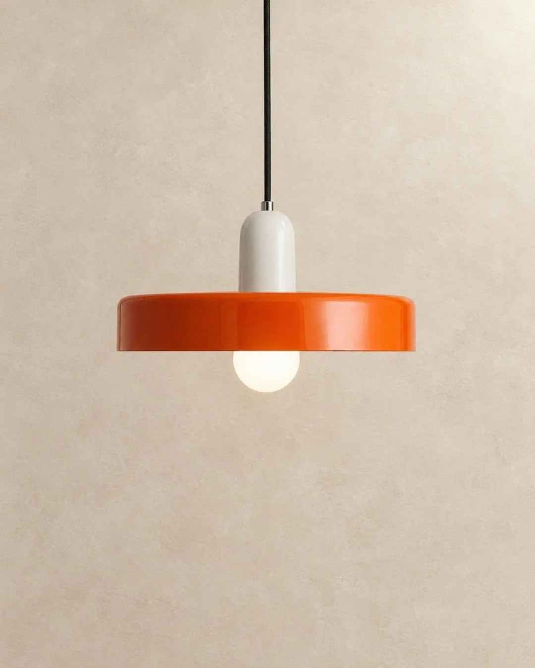 Orange pendant light with white holder