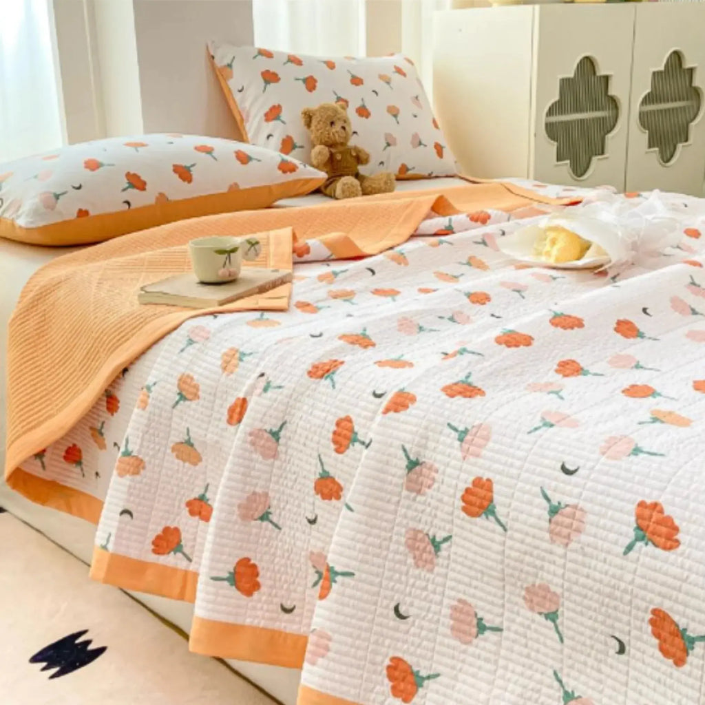 Orange tulip bedding set on bed