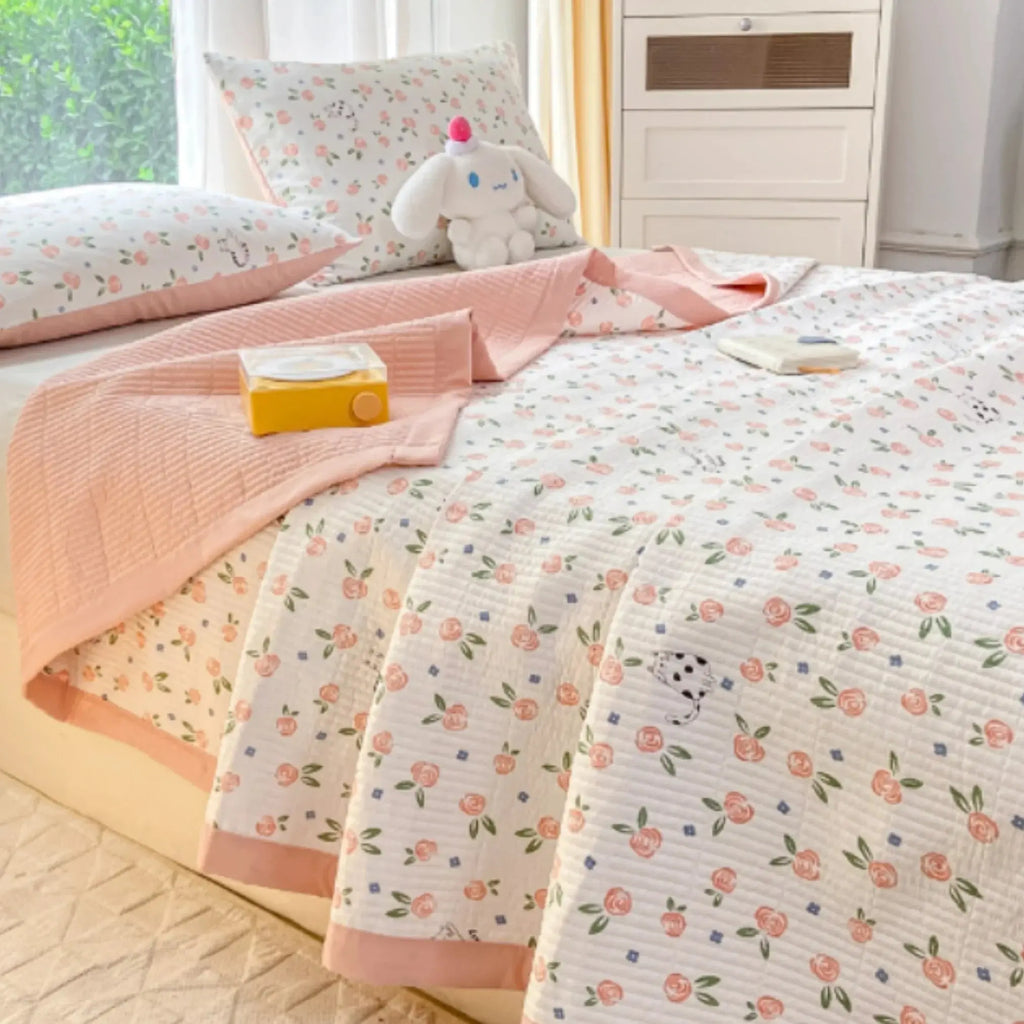 Peach floral bedding set on bed