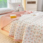 Peach floral bedding set on bed
