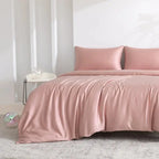 Pink bamboo sheet set on bed