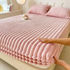Pink faux fur fitted sheet on bed