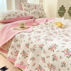 Pink floral bedding set on bed