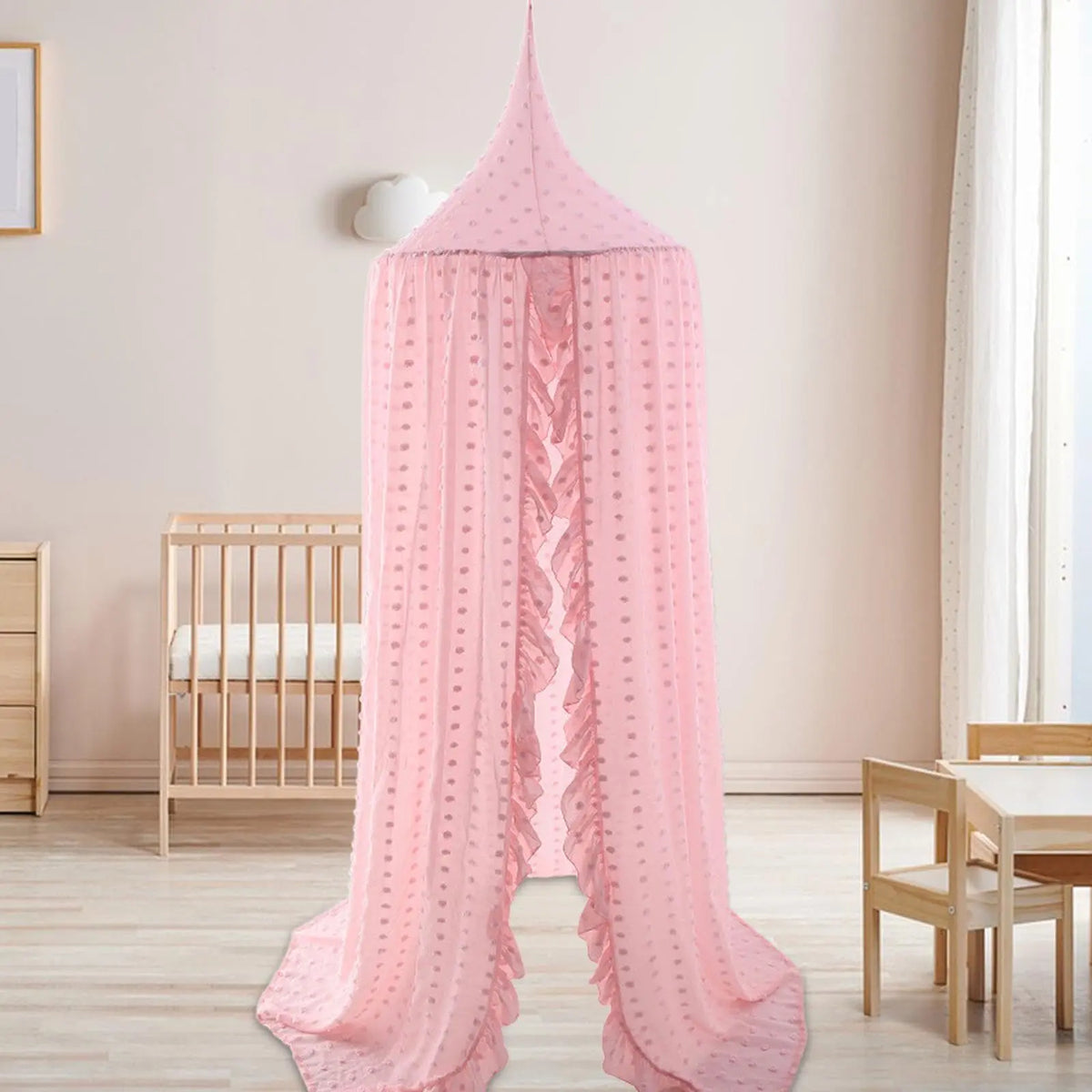 Pink hanging canopy in kids room