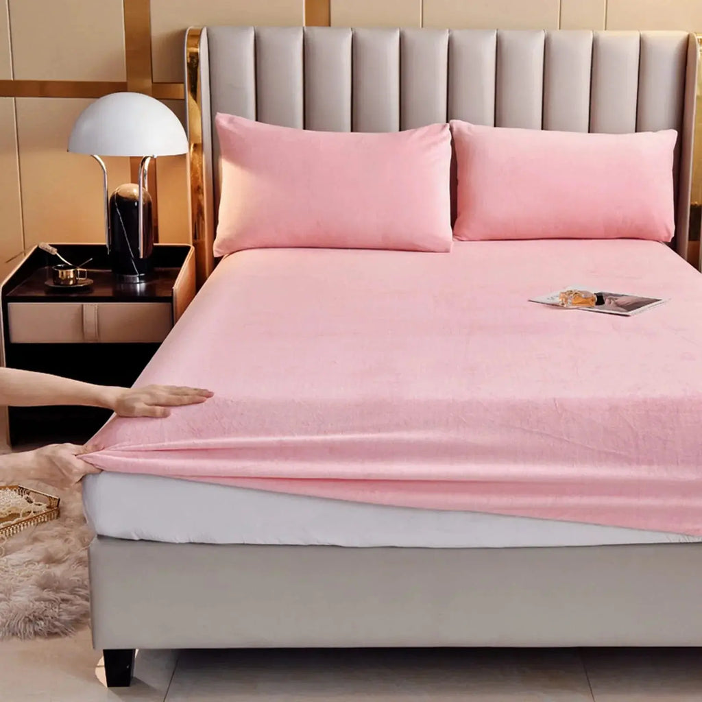 Pink velvet fitted sheet on bed