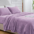 Purple fleece sheet set on bed
