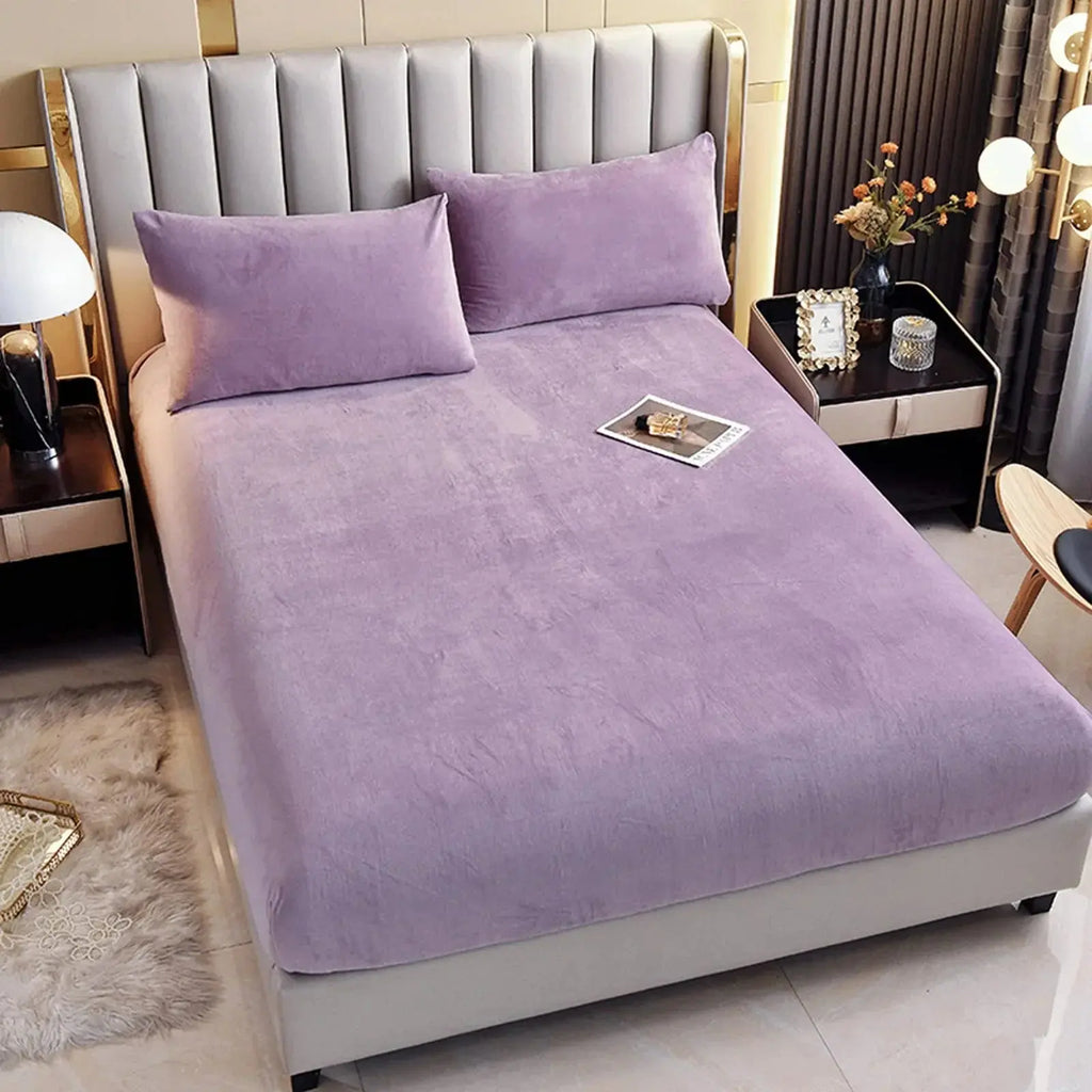 Purple plush fitted sheet on mattress