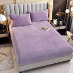 Purple plush fitted sheet on mattress
