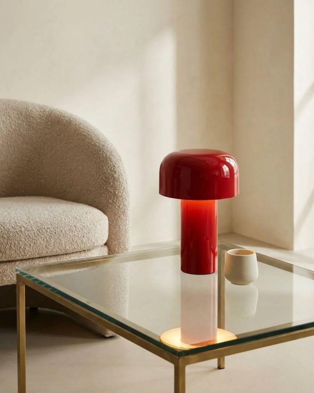 Red cordless lamp on glass table