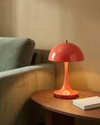 Red mushroom lamp on side table