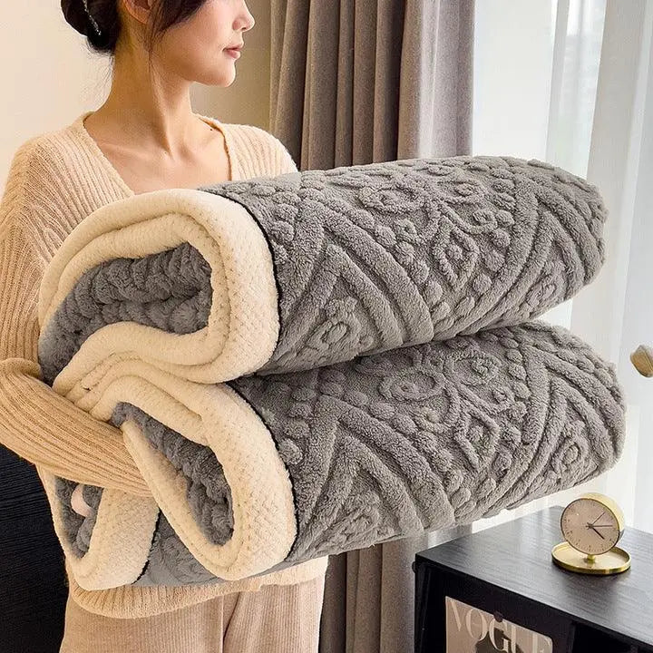 Rolled gray embossed sherpa blanket