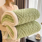Rolled green embossed sherpa blanket