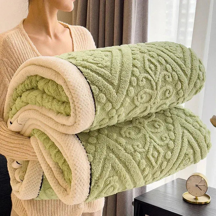 Rolled green embossed sherpa blanket